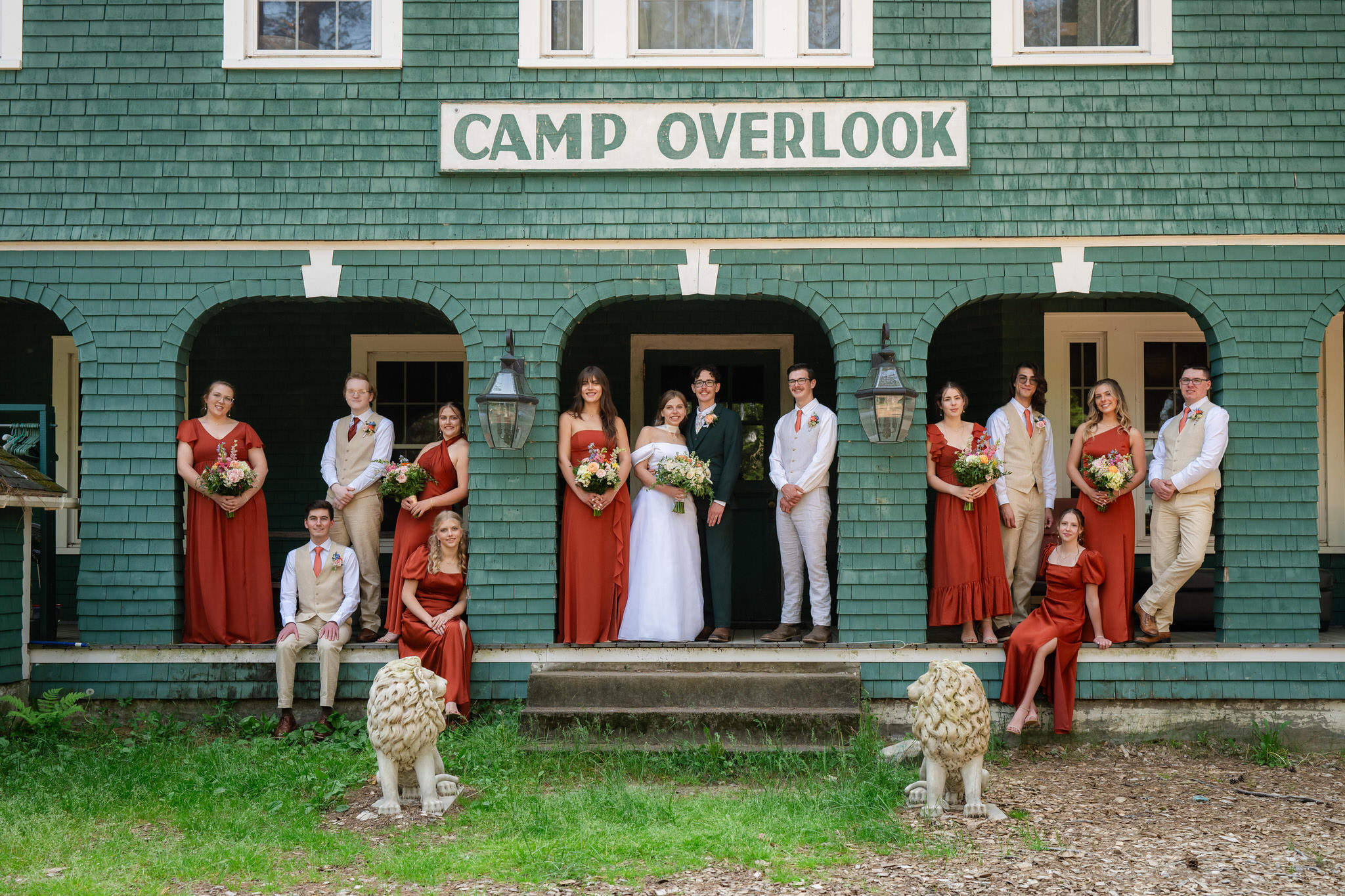 Wedding party gathered outside Camp Overlook