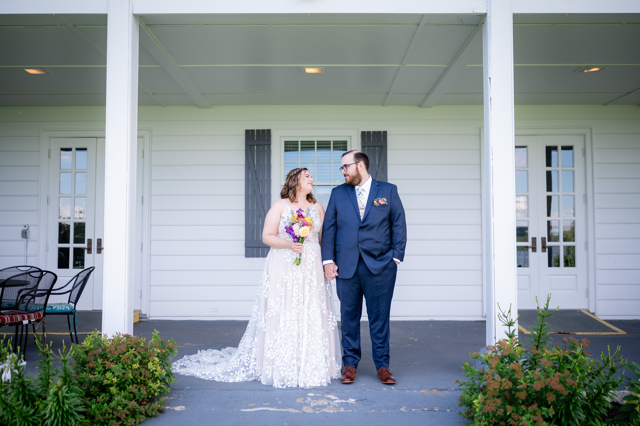 Newlyweds photographed outside their Northern New York wedding venue